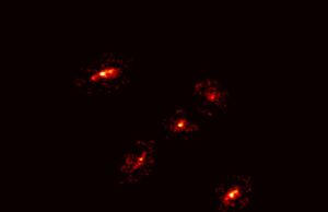 A Newly Discovered ‘Einstein’s Cross’ Reveals the Existence of a Giant Dark Matter Halo